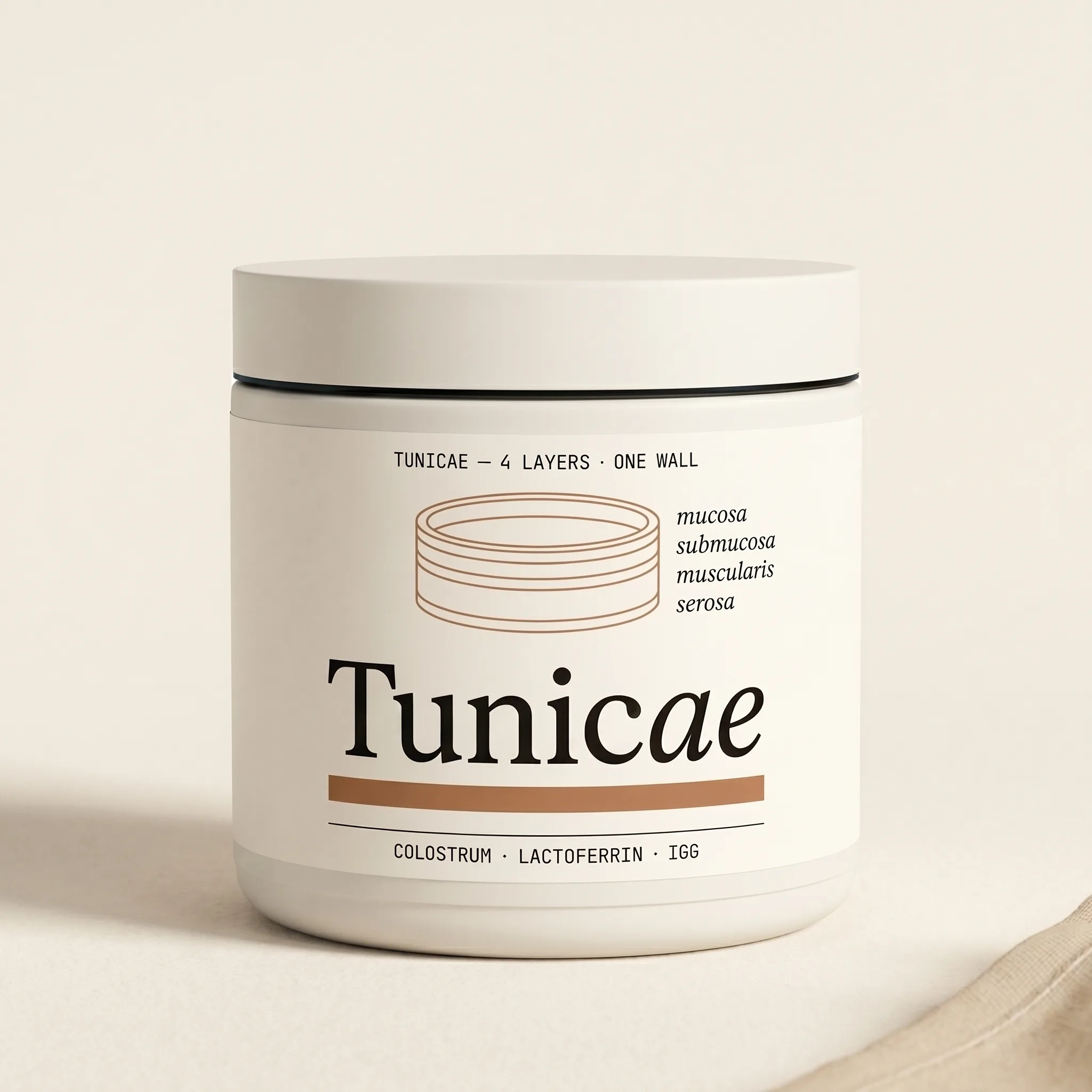 TUNICAE colostrum jar centered on warm-bone parchment in soft north light